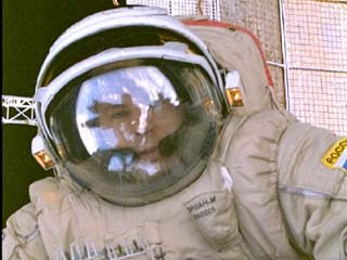 Mir-24 Commander Anatoly Solovyev repairs damage to the Mir Space Station during an Extravehicular Activity (EVA) photographed by Mission Specialist David Wolf. 